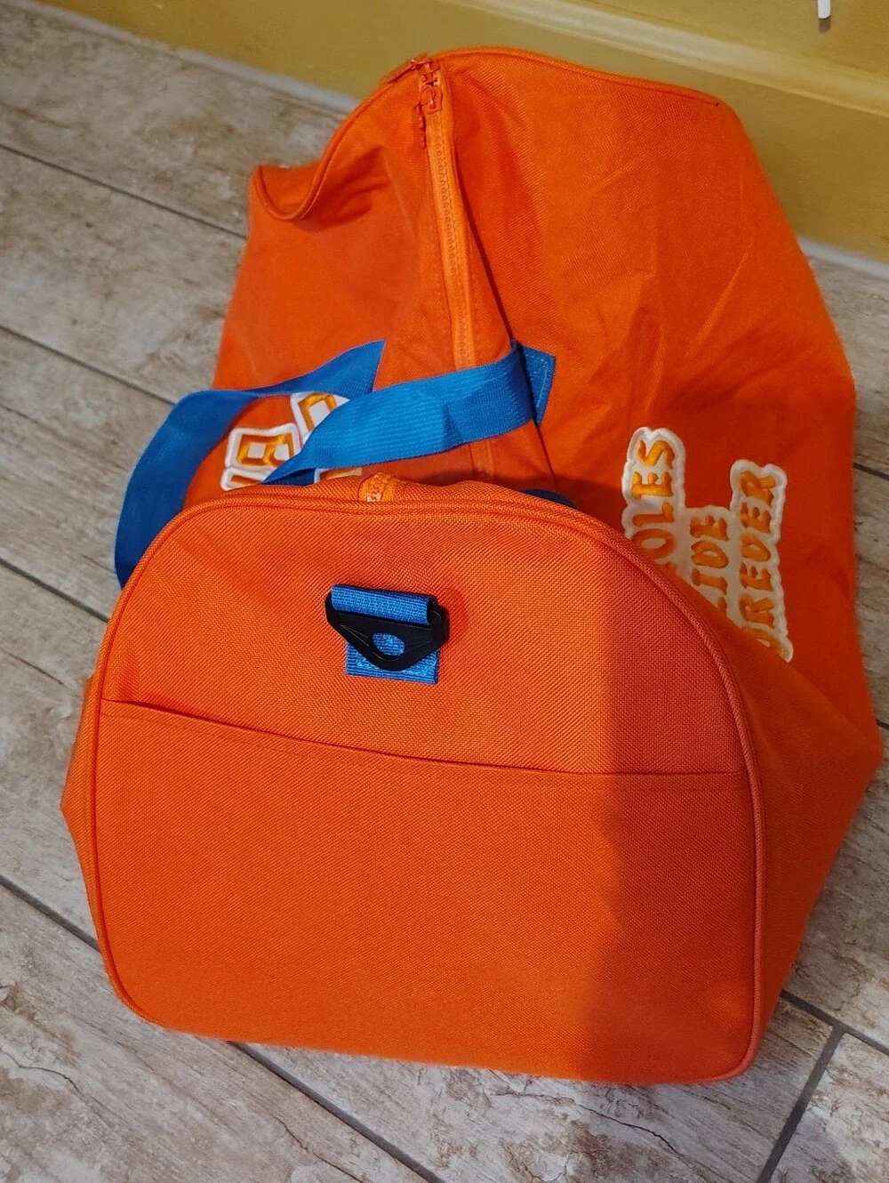 Emotional Baggage Orange Duffel Bag with Blue Handles